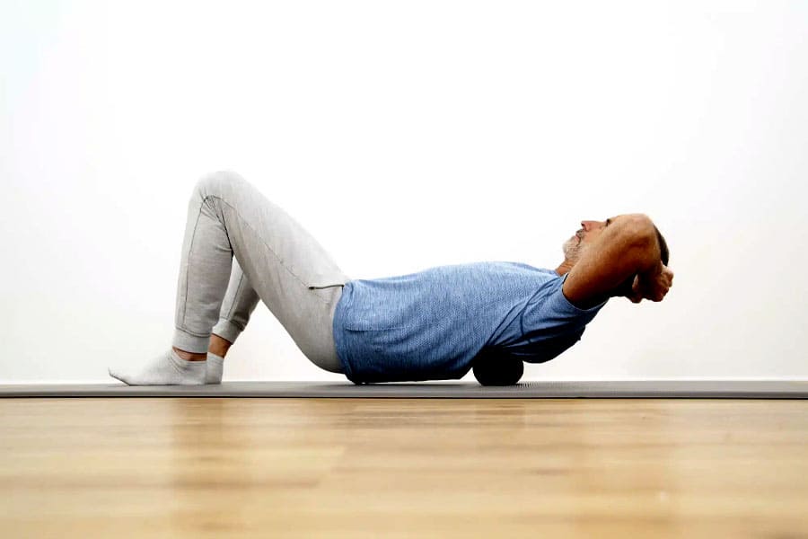 relaxing all the back muscles using a ball or roller 1