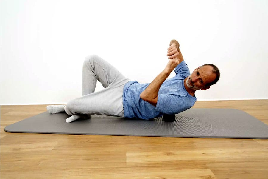 relaxing all the back muscles using a ball or roller 2